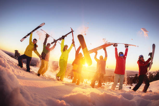 istock Happy friends at ski resort having fun sunset 1029280884