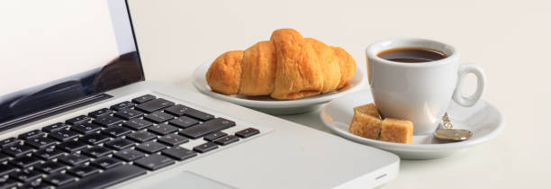 istock Cup of coffee and a laptop 1029290074