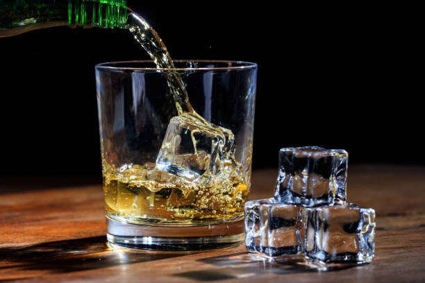 istock Pouring whiskey in a glass 1029297158