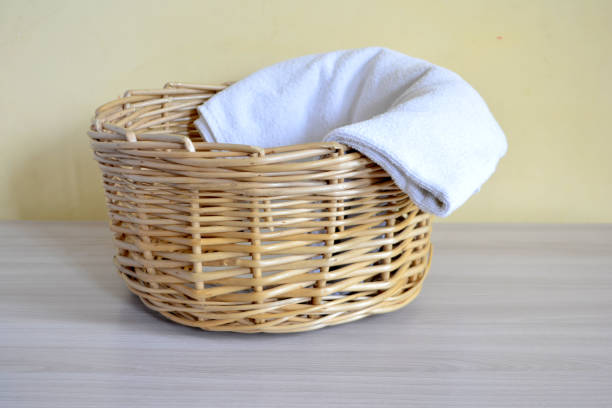 istock Wicker basket with towels on a light background 1029297606