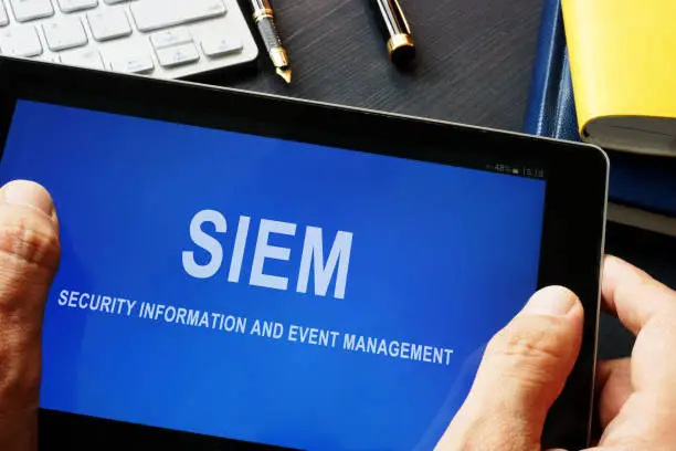 SIEM Security information and event management program in a tablet.