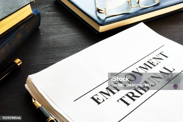 Employment Tribunal Documents Note Pad And Glasses Stock Photo - Download Image Now