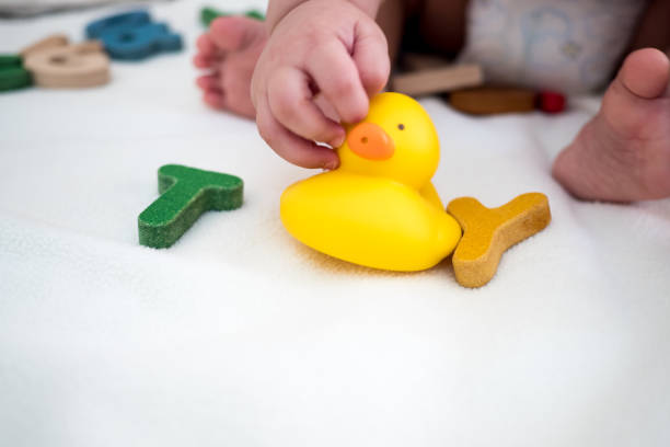 istock Toy text wooden word top view on blanket with kid and copy space background 1029304192