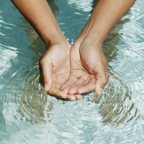 istock Clear water in woman hands 1029311306