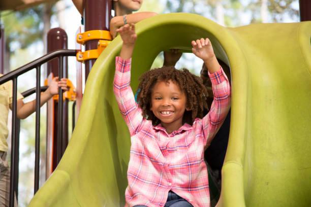 istock Multi-ethnic group of school children playing on school playground. 1029316338