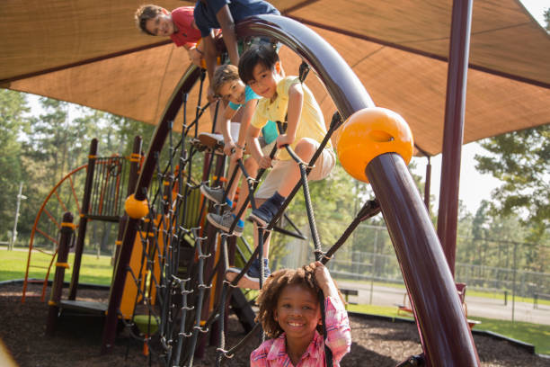 istock Multi-ethnic group of school children playing on school playground. 1029316402