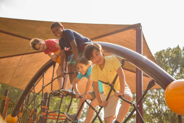 istock Multi-ethnic group of school children playing on school playground. 1029316548