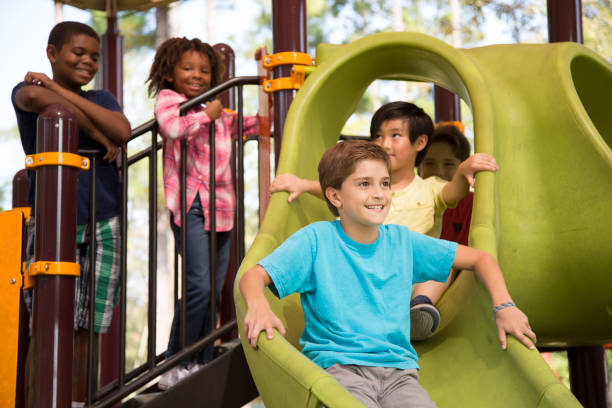 istock Multi-ethnic group of school children playing on school playground. 1029316564