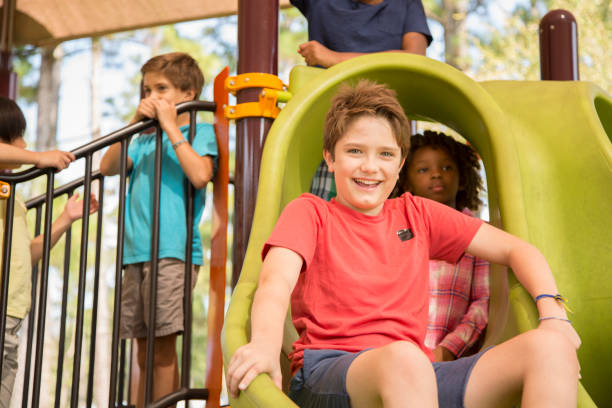 istock Multi-ethnic group of school children playing on school playground. 1029316574