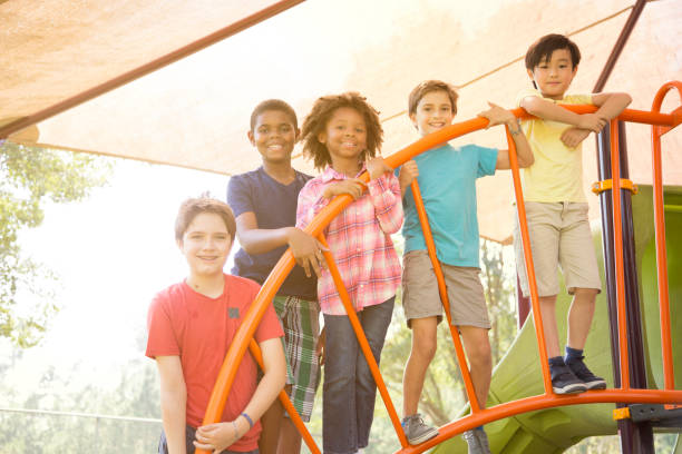istock Multi-ethnic group of school children playing on school playground. 1029316668