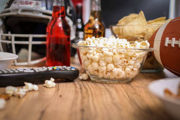 istock Watching the football game with snacks, drinks. 1029316892