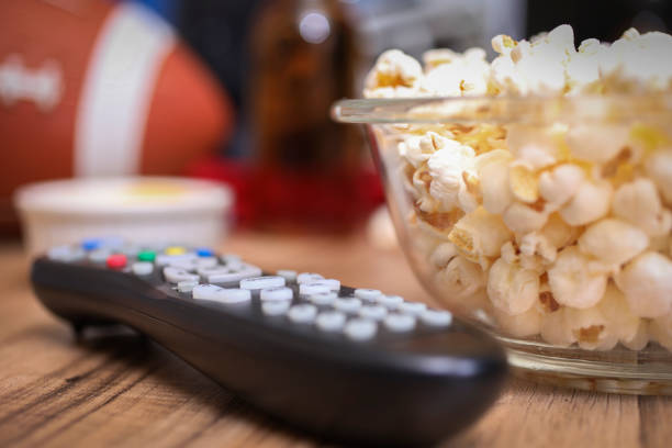 istock Watching the football game with snacks, drinks. 1029316904