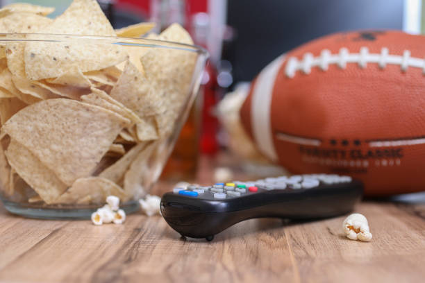 istock Watching the football game with snacks. 1029316920