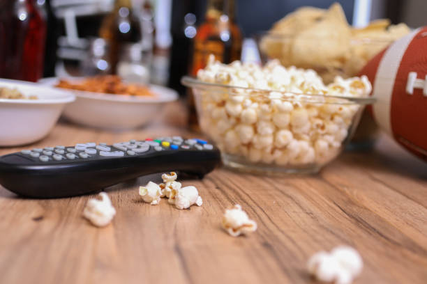 istock Watching the football game with snacks, drinks. 1029316948