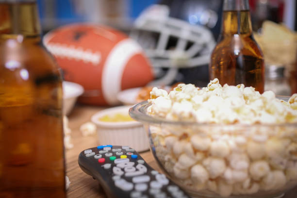 istock Watching the football game with snacks, drinks. 1029316970
