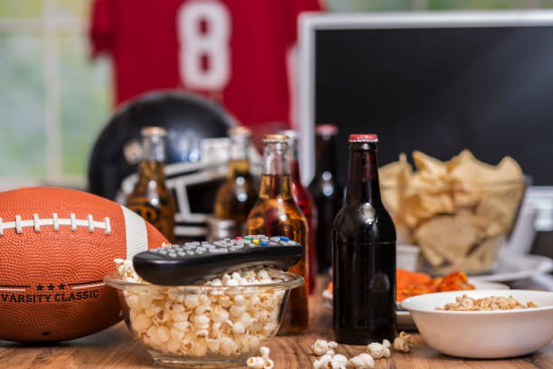 istock Watching the football game with snacks, drinks. 1029316976