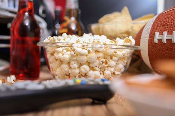 istock Watching the football game with snacks, drinks. 1029317084