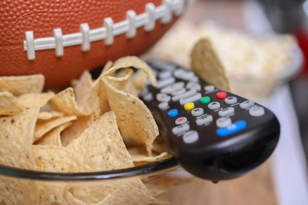 istock Watching the football game with snacks. 1029317120