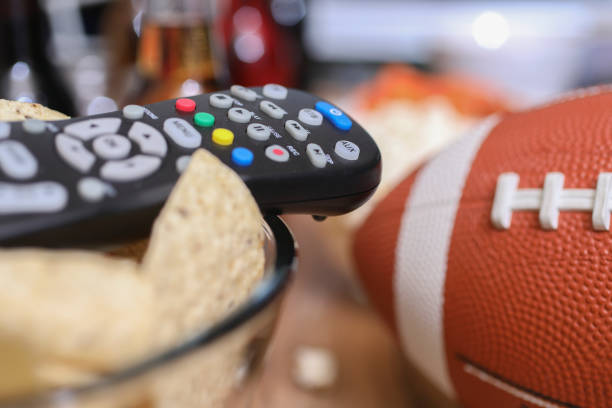 istock Watching the football game with snacks. 1029317188