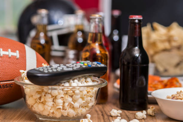 istock Watching the football game with snacks, drinks. 1029317200