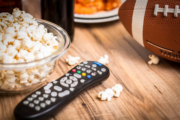 istock Watching the football game with snacks, drinks. 1029317226
