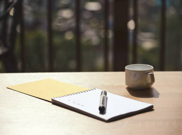 istock notebook with a marker on the table in the cafe 1029319640