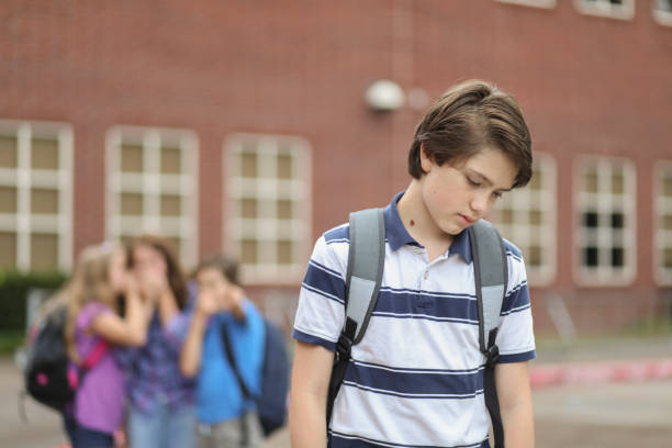 istock Pre-adolescent boy being bullied at school. 1029320020