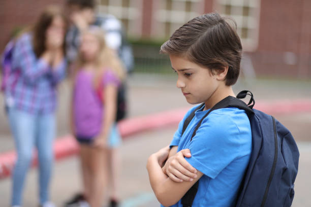 istock Elementary age boy being bullied at school. 1029320062