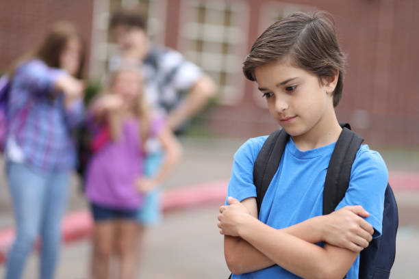 istock Elementary age boy being bullied at school. 1029320158