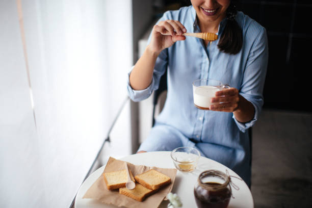 istock Woman preparing healthy breakfast at home 1029323880