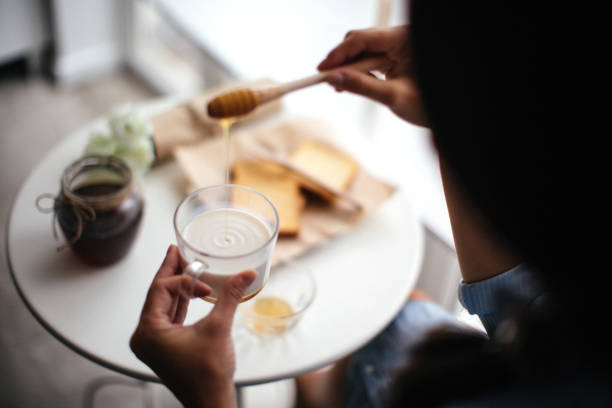 istock Woman preparing healthy breakfast at home 1029325382