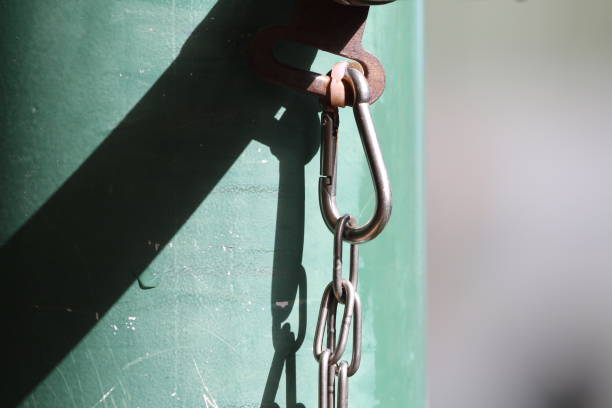 istock Close-Up Of Chain Hanging By Wall 1029328504