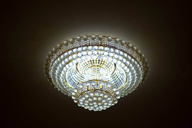 Light concept, chandelier or ceiling light on blurred room modern hotel background. Beautiful chandelier electricity save energy.