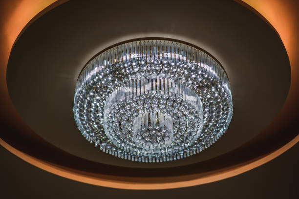 istock Light concept, chandelier or ceiling light on blurred room 1029329468