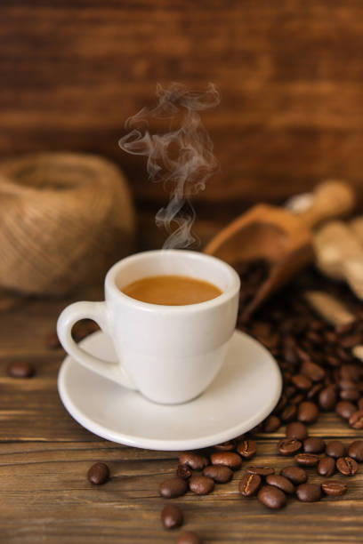 istock coffee espresso isolated on wooden table 1029336898
