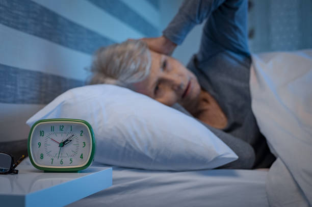 istock Senior woman with terrible headache 1029339630