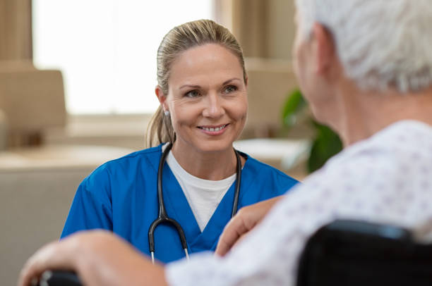 nurse take care of senior patient - wheelchair disabled senior adult female nurse imagens e fotografias de stock