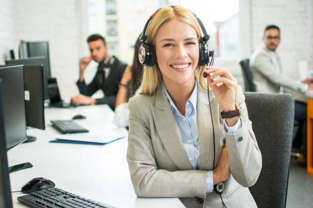 istock Cheerful young blonde customer service operator at call center 1029340668