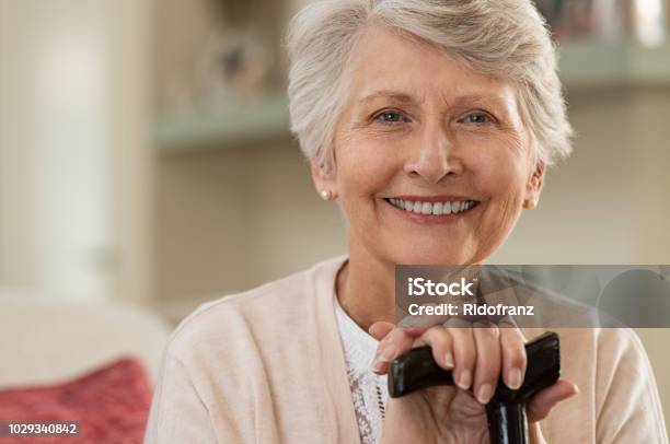 Elderly Woman Smiling At Home Stock Photo - Download Image Now - Senior Adult, Smiling, Senior Women