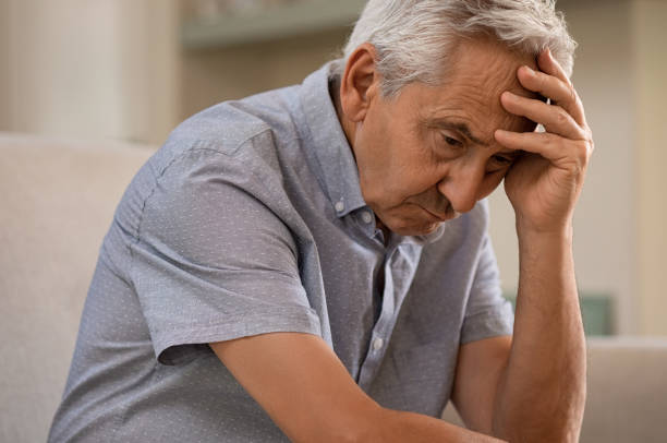 istock Depressed senior man at home 1029342942