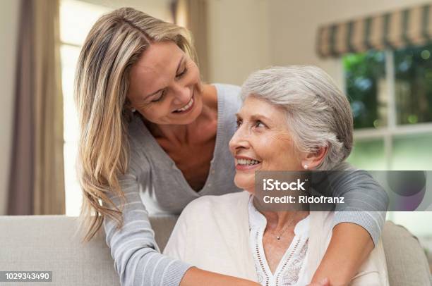 Woman Embracing Senior Mother Stock Photo - Download Image Now - Senior Adult, Mother, Daughter