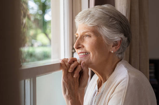 istock Happy senior woman looking away 1029343754