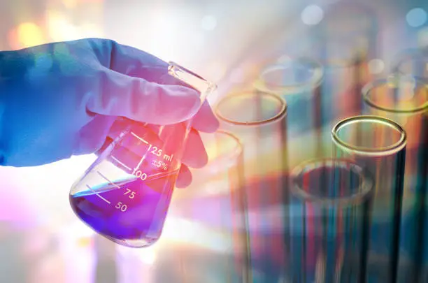 Photo of Cropped Hand Of Scientist Testing Chemicals In Laboratory