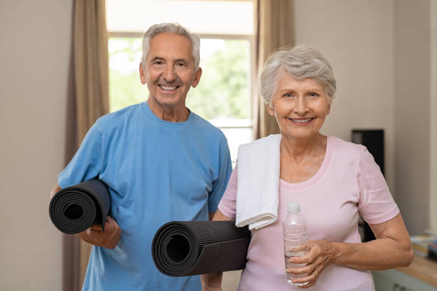 istock Active elderly couple ready for yoga 1029344658