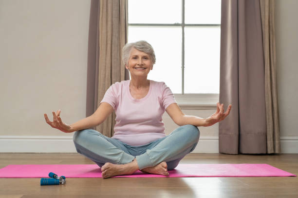 istock Senior woman doing yoga 1029344956