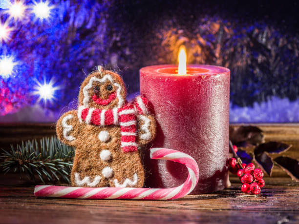 istock Christmas candle, ginger man toy and candy canes. 1029350304