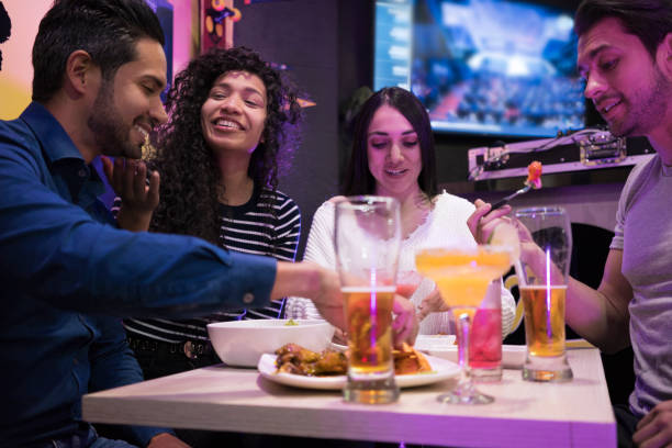 istock Friends enjoying a delicious meal 1029350642