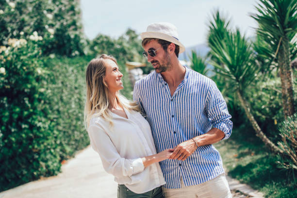 istock Beautiful couple taking a walk in city park 1029357148
