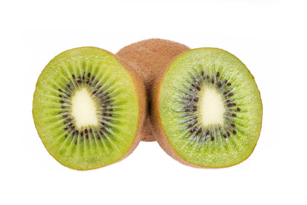 One whole and two half ripe and fresh Kiwi fruits isolated on white background