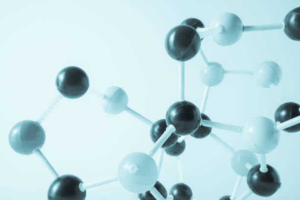 istock Close-Up Of Atoms Against White Background 1029361046